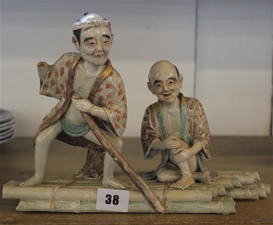 Japanese pottery group of two men on a raft